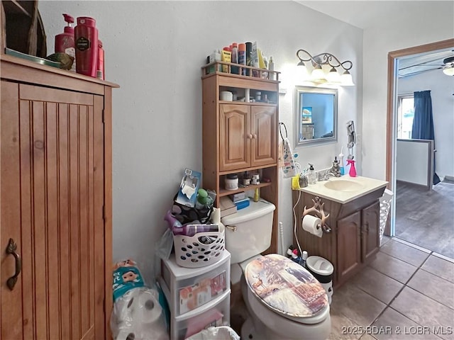 bathroom with vanity, toilet, and tile patterned floors