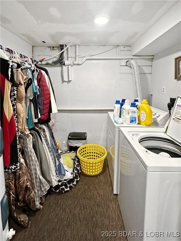 clothes washing area with laundry area and washing machine and clothes dryer