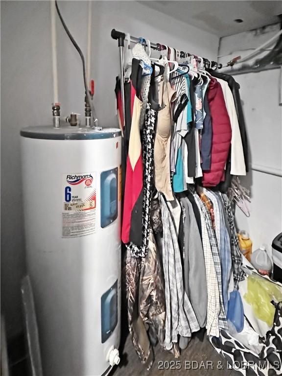 utility room featuring electric water heater