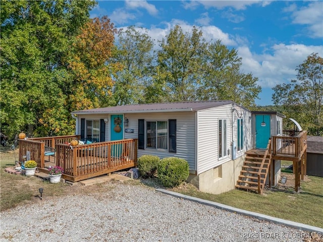 view of front of property with metal roof and a deck