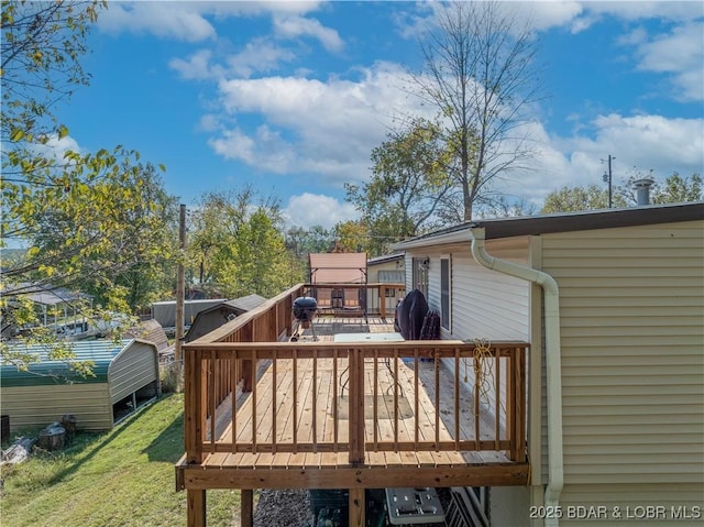 wooden deck with area for grilling