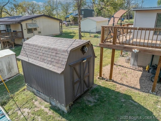 view of shed with fence