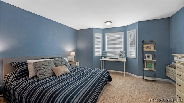 bedroom featuring carpet flooring and baseboards