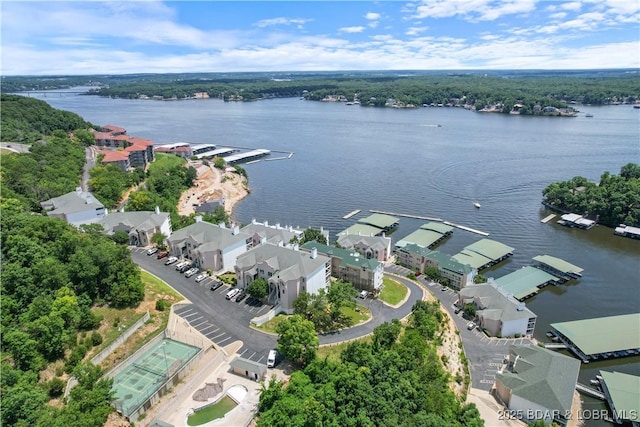 drone / aerial view with a water view and a residential view