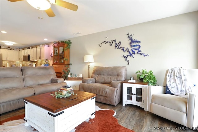 living room with a ceiling fan, wood finished floors, and recessed lighting