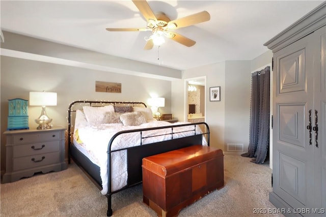 bedroom featuring light carpet, visible vents, and a ceiling fan