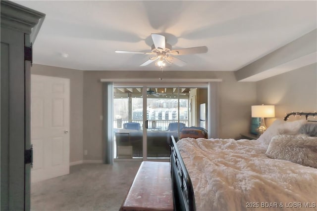 bedroom featuring baseboards, a ceiling fan, freestanding refrigerator, access to exterior, and carpet floors