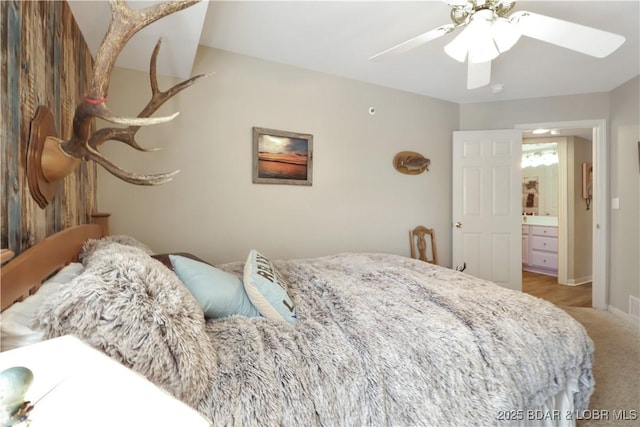 carpeted bedroom featuring ceiling fan and baseboards