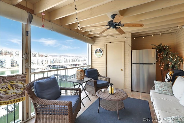 balcony with an outdoor hangout area and a ceiling fan