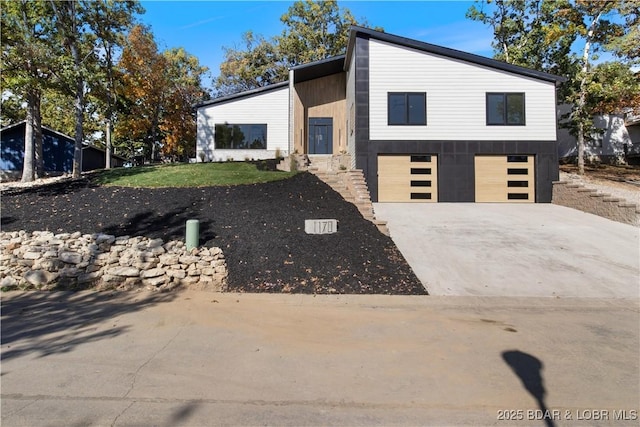 view of front of property with an attached garage and driveway