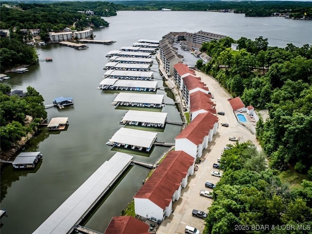 birds eye view of property featuring a water view