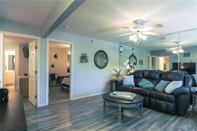 living room with a ceiling fan, visible vents, baseboards, and dark wood-style flooring