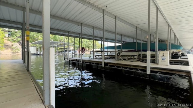 view of dock with a water view