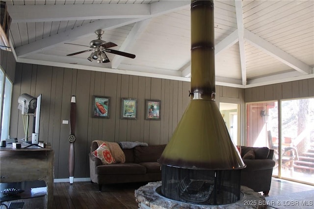 living area featuring lofted ceiling with beams, wood walls, and wood-type flooring