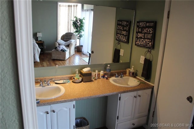 bathroom with double vanity and a sink