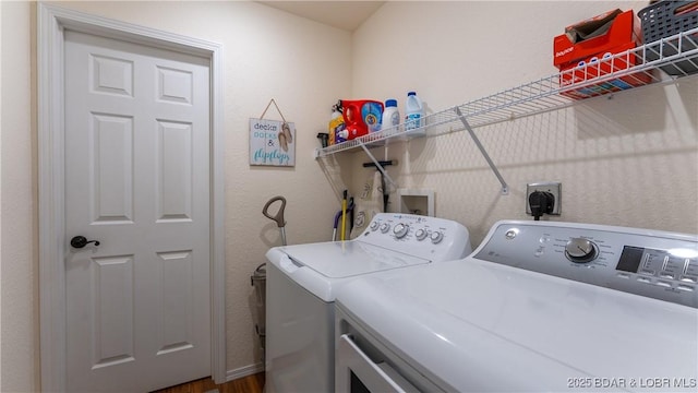 clothes washing area featuring laundry area and separate washer and dryer