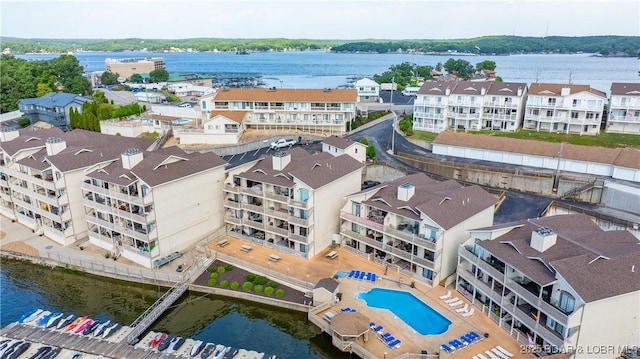 birds eye view of property with a water view