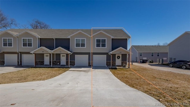 view of front of property featuring driveway and an attached garage