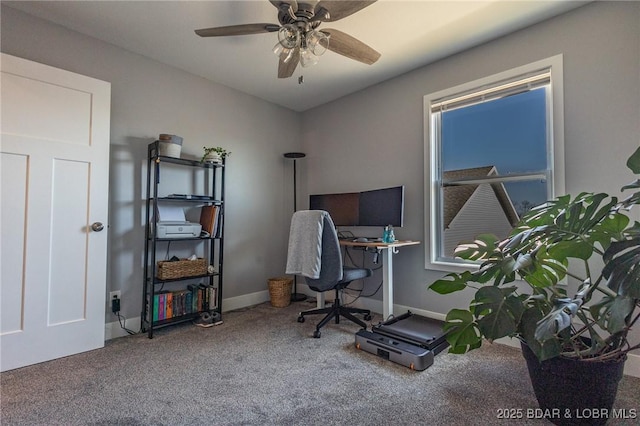 office area with carpet floors, baseboards, and a ceiling fan