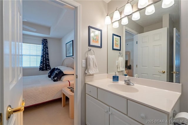 bathroom with vanity and ensuite bathroom