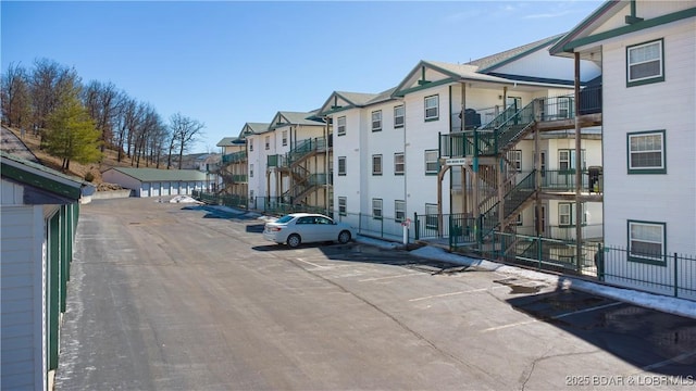 view of street with stairs and a residential view