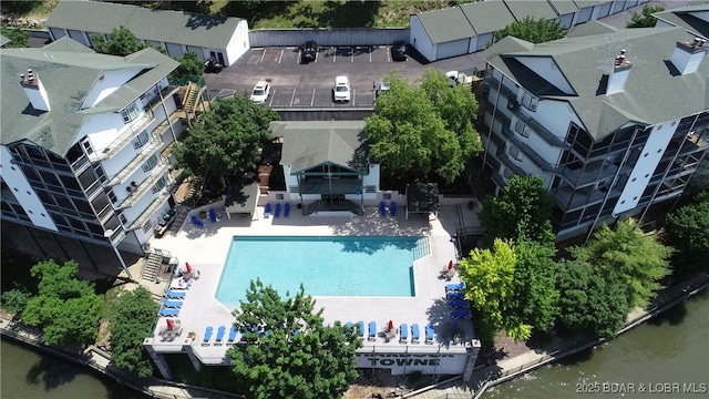 birds eye view of property with a water view