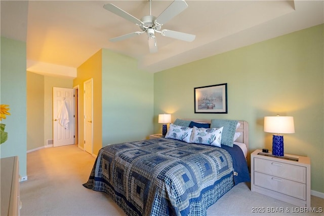 bedroom with carpet floors, baseboards, and a ceiling fan