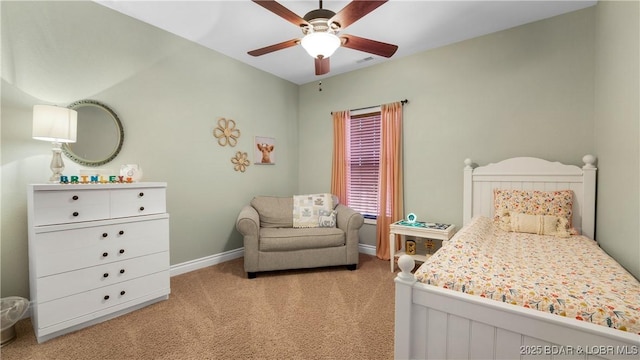 bedroom with light carpet, ceiling fan, visible vents, and baseboards