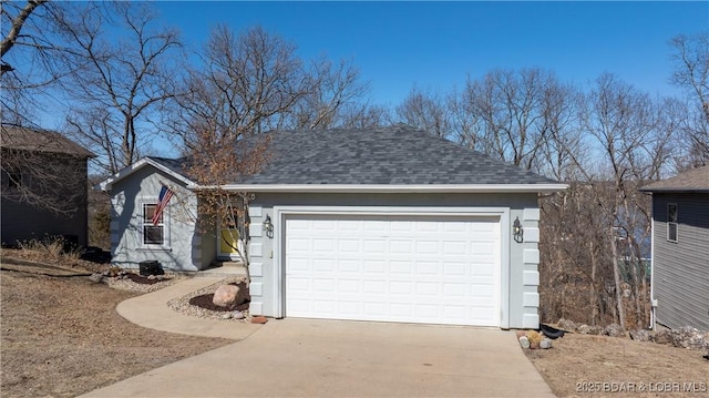 view of front of property with an attached garage, stucco siding, concrete driveway, and roof with shingles