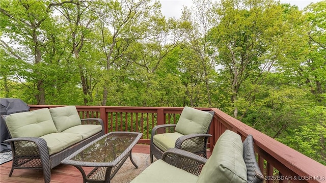 wooden terrace featuring an outdoor living space