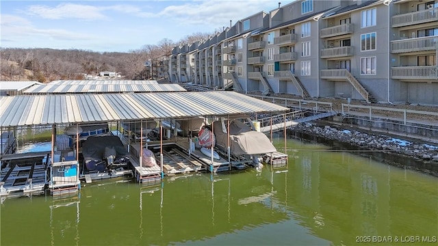 dock area featuring a water view and boat lift