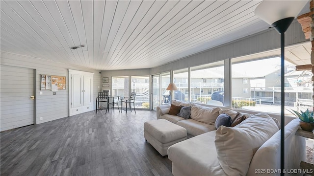 unfurnished sunroom featuring wood ceiling