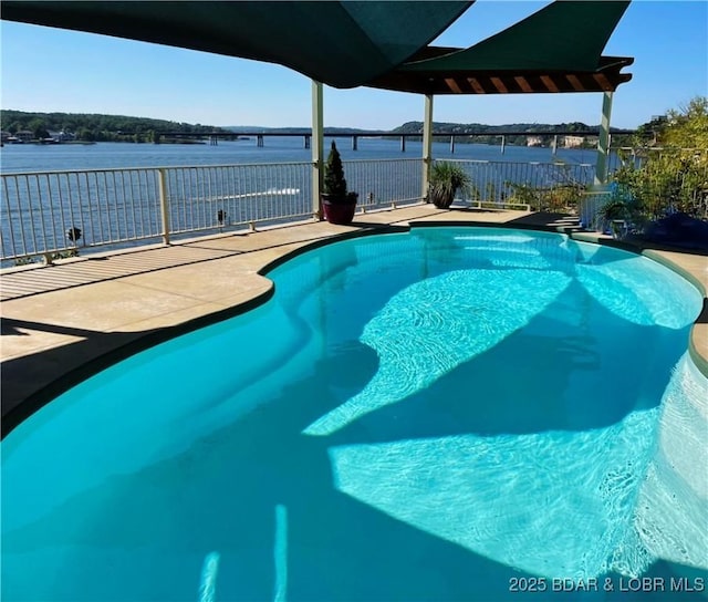 outdoor pool featuring a patio