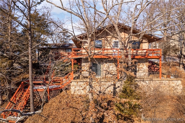 view of property exterior with stone siding