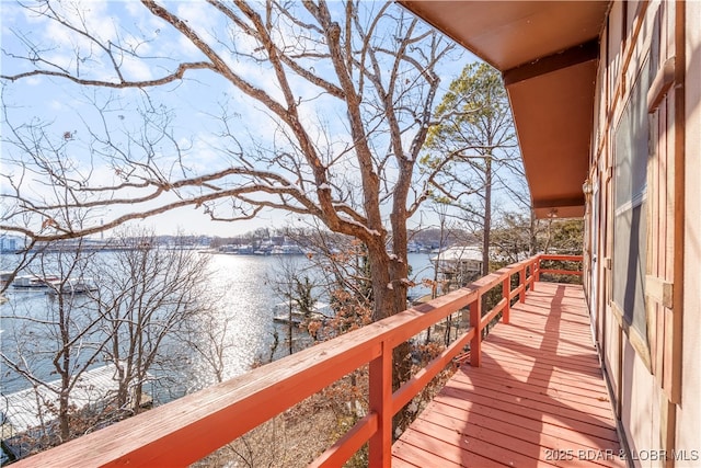 wooden deck featuring a water view