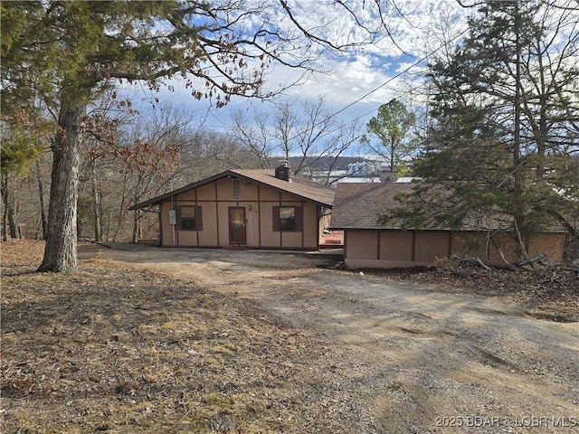 view of outdoor structure with driveway