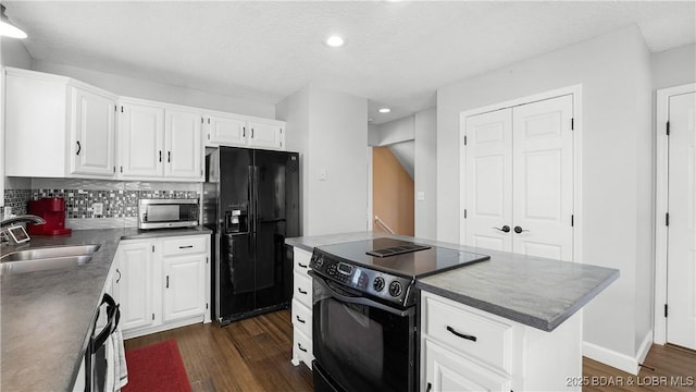 5317 Locust Ct, Osage Beach, MO 65065 - kitchen with black appliances, a sink, dark wood-style flooring, white cabinets, and recessed lighting