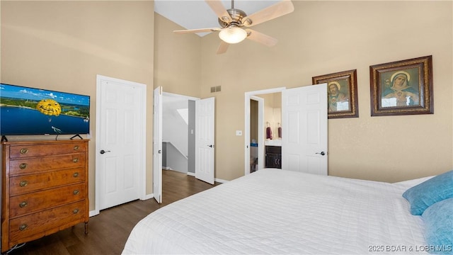 5317 Locust Ct, Osage Beach, MO 65065 - bedroom with a towering ceiling, dark wood-style floors, baseboards, and ceiling fan
