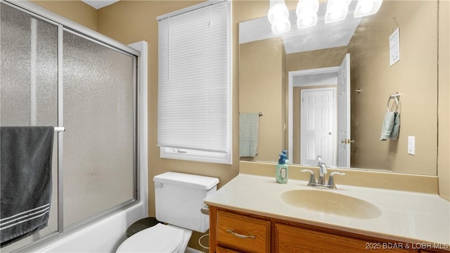 5317 Locust Ct, Osage Beach, MO 65065 - full bathroom with toilet, vanity, a chandelier, and enclosed tub / shower combo