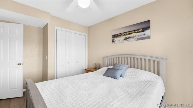 5317 Locust Ct, Osage Beach, MO 65065 - bedroom with a closet, wood finished floors, and ceiling fan