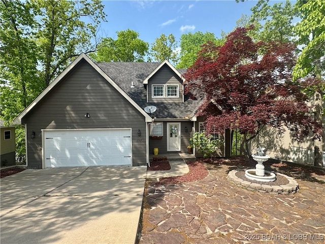 5317 Locust Ct, Osage Beach, MO 65065 - traditional-style home featuring concrete driveway, an attached garage, and a shingled roof
