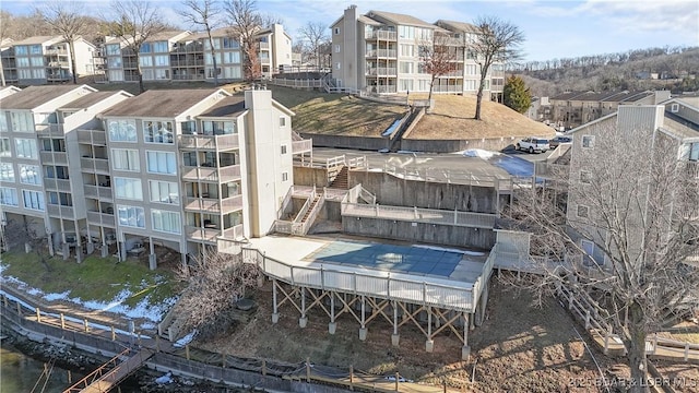 exterior space with a water view and stairs