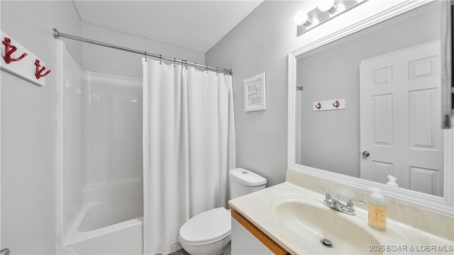 bathroom featuring a textured ceiling, shower / tub combo, vanity, and toilet