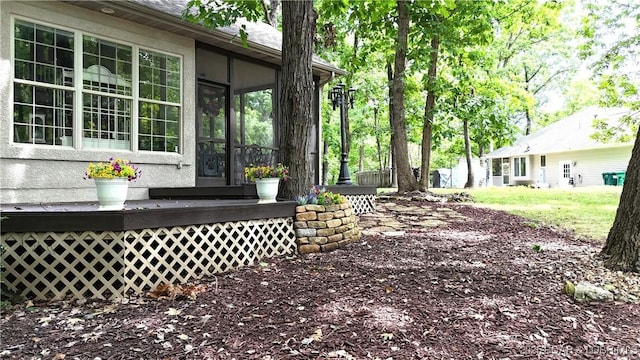 view of yard featuring a sunroom