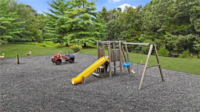 communal playground featuring a lawn