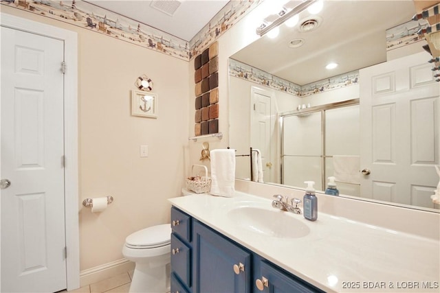 bathroom with a stall shower, visible vents, vanity, and toilet