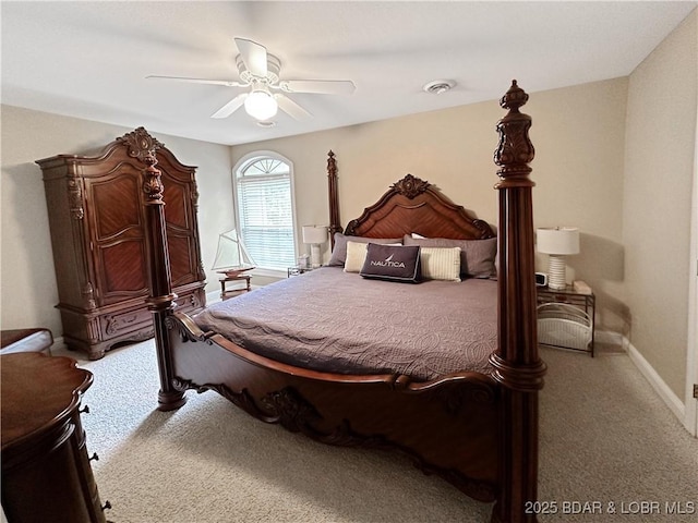 carpeted bedroom featuring visible vents, ceiling fan, and baseboards