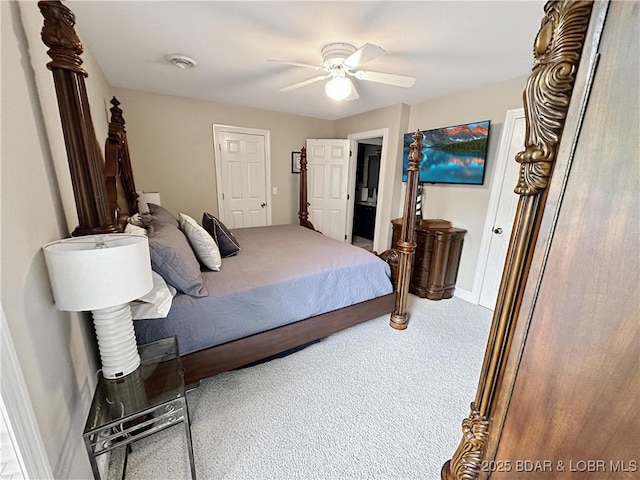 carpeted bedroom featuring a ceiling fan and baseboards