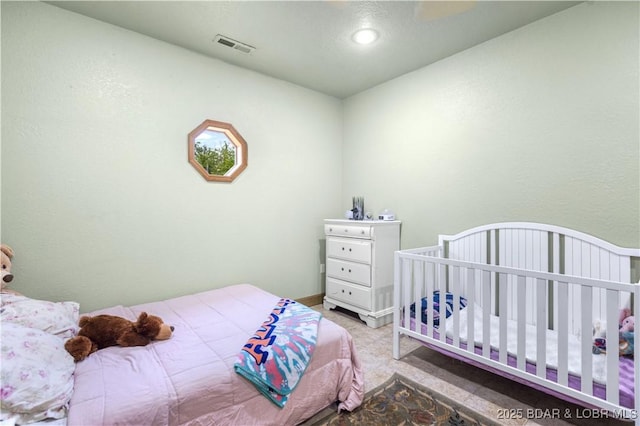 bedroom featuring carpet floors and visible vents