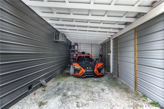 view of car parking with a carport and an AC wall unit